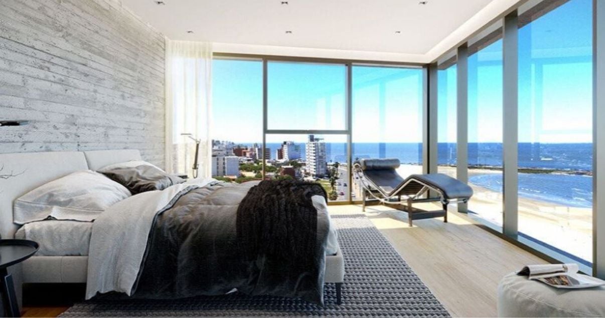 Render del interior de una habitación de Torre arenas con vista al mar